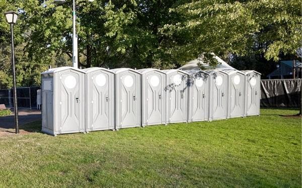 Construction site portable toilets positioned near an active O'Fallon, MO job site