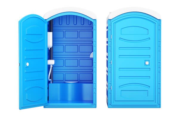 Clean interior of a standard portable toilet unit with hand sanitizer dispenser